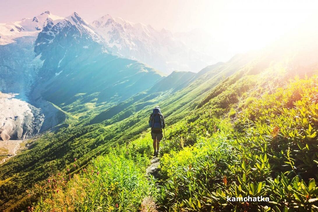 solitary woman hiking in mountains