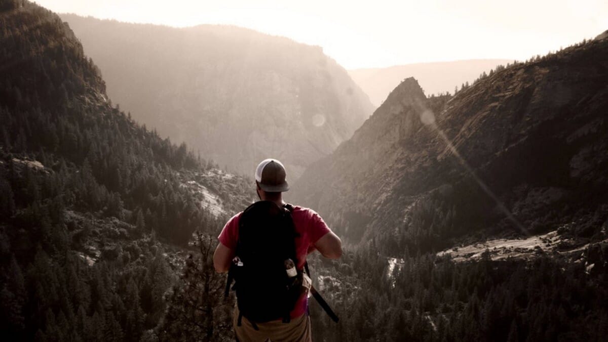 man hiking in mountains