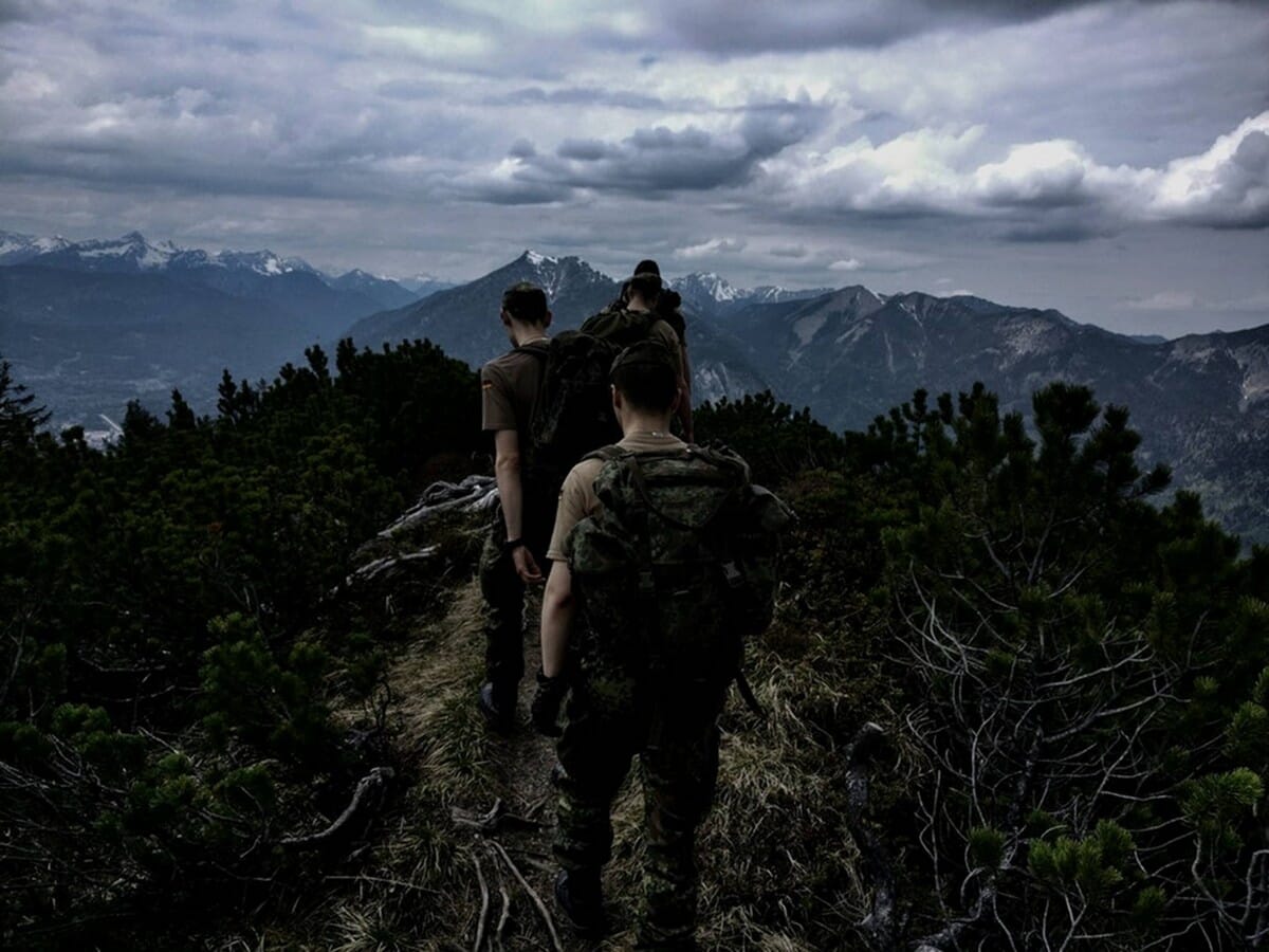 4 hikers on mountian ridge