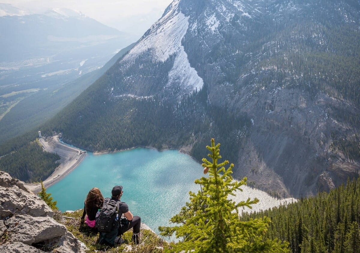 Couple overlooking mountain lake