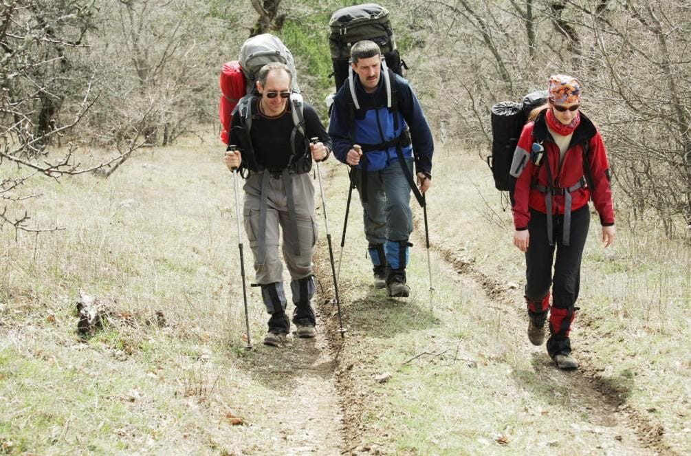 Walking in a group of hikers