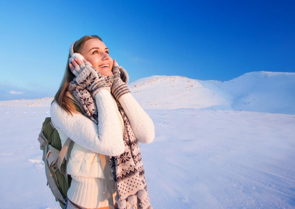 Girl bundled up outdoors in winter - Aarn backpacks